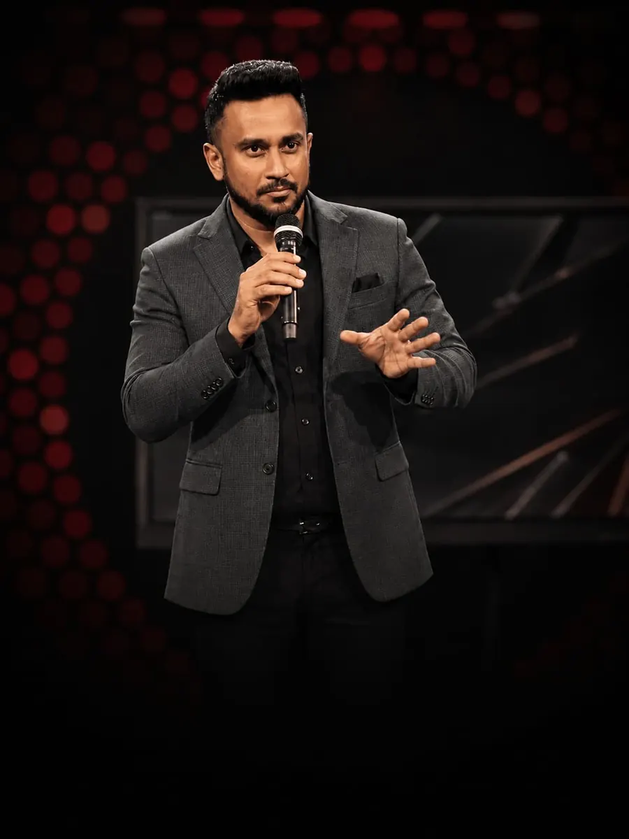 A TV Sri Lanka host presenting at a corporate launch